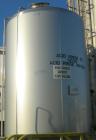 USED: Walker 5,000 gallon, type 304L stainless steel, storage tank. Vertical, dished heads. Approximate 8' diameter x 12' straight side. Misc top and side flanged openings. Bottom has a 2