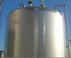 USED: Walker 5,000 gallon, type 304L stainless steel, storage tank. Vertical, dished heads. Approximate 8' diameter x 12' straight side. Misc top and side flanged openings. Bottom has a 2