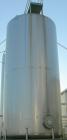 USED: Walker 21,000 gallon, type 304L stainless steel, storage tank. Vertical, dished heads, approximate 12' diameter x 24' straight side. Top openings include an 18