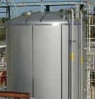 USED: Walker 21,000 gallon, type 304L stainless steel, storage tank. Vertical, dished heads, approximate 12' diameter x 24' straight side. Top openings include an 18