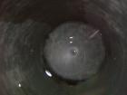 USED: Walker 21,000 gallon, type 304L stainless steel, storage tank. Vertical, dished heads, approximate 12' diameter x 24' straight side. Top openings include an 18