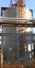 USED: Walker 16,000 gallon, type 316L stainless steel, storage tank. Vertical, dished heads. Approximate 12' diameter x 18' straight side. Misc top and side flanged openings. Side openings include an...