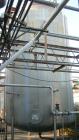 USED: Walker 16,000 gallon, type 316L stainless steel, storage/mix tank. Vertical, dished heads. Approximate 12' diameter x 18' straight side. Misc top and side flanged openings. Side openings includ...