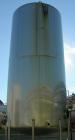 USED: Walker 21,000 gallon, type 304L stainless steel, storage tank. Vertical, dished heads. 12' diameter x 24' straight side. Top openings include an 18