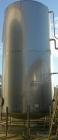 USED: Walker 21,000 gallon, type 304L stainless steel, storage tank. Vertical, dished heads. Approximate 12' diameter x 24' straight side. Top openings include an 18