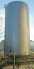 USED: Walker 21,000 gallon, type 304L stainless steel, storage tank. Vertical, dished heads. Approximate 12' diameter x 24' straight side. Top openings include an 18