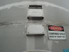Used Whiting Metals 6,500 gal 316L Stainless Steel Vertical Tank.  Rated ATM @ 150 F. Dimensions:  8'dia x 21'h.  Flat bottom. Serial # F-7069. Built 1996.