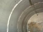 Used- Wolfe Mechanical and Equipment Tank, 14,000 gallon, 304L stainless steel, vertical. Approximately 144