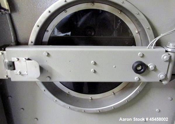 Used Milnor washer-extractor, model 42032 X7J, 170 lb capacity, 24"opening,  42" diameter x 32" deep chamber, 25.7 cu ft cylinder volume, rated for 709 maximum RPM (during extraction), 15 hp motor, 4...