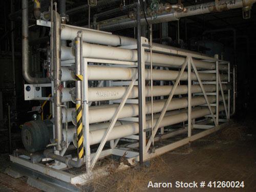 Used Zenon Environmental Inc Reverse Osmosis System. 250 psi operating pressure at 35 deg C, perm rate 240 USGPM, 11 tubes are 9" diameter and 12'6" in length, 120V, 15A, 1 phase, 60 Hz. System has 1...