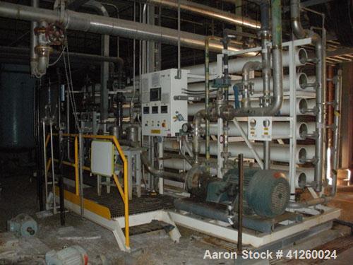 Used Zenon Environmental Inc Reverse Osmosis System. 250 psi operating pressure at 35 deg C, perm rate 240 USGPM, 11 tubes are 9" diameter and 12'6" in length, 120V, 15A, 1 phase, 60 Hz. System has 1...
