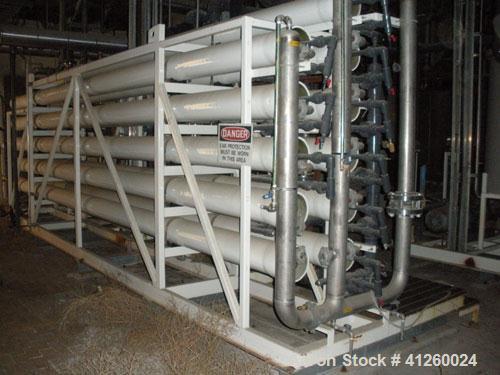 Used Zenon Environmental Inc Reverse Osmosis System. 250 psi operating pressure at 35 deg C, perm rate 240 USGPM, 11 tubes are 9" diameter and 12'6" in length, 120V, 15A, 1 phase, 60 Hz. System has 1...