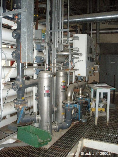 Used Zenon Environmental Inc Reverse Osmosis System. 250 psi operating pressure at 35 deg C, perm rate 240 USGPM, 11 tubes are 9" diameter and 12'6" in length, 120V, 15A, 1 phase, 60 Hz. System has 1...