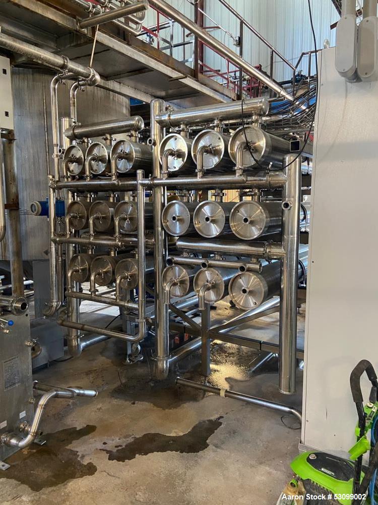 Unused- Reverse Osmosis Filtration System. 9500 liter/hour capacity. 2205 square meters total membrane area. System consisting of: (18) filters; 316 SS CIP tank; (2) 3500 RPM CIP pumps; Goulds booste...