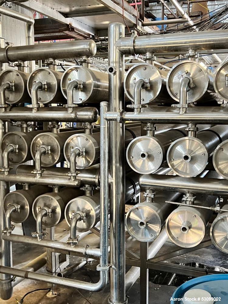 Unused- Reverse Osmosis Filtration System. 9500 liter/hour capacity. 2205 square meters total membrane area. System consisting of: (18) filters; 316 SS CIP tank; (2) 3500 RPM CIP pumps; Goulds booste...