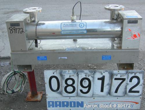 Used- Aquafine Ultraviolet Disinfection Unit, 316 stainless steel. Approximate 4" diameter x 30" long tube. 2" inlet/outlet....