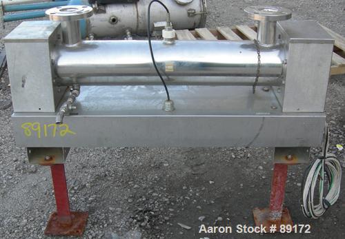 Used Aquafine Ultraviolet Disinfection Unit, 316 stainless steel. Approximate 4" diameter x 30" long tube. 2" inlet/outlet. Mounted on 2 carbon steel legs.