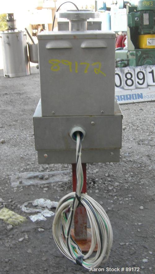 Used Aquafine Ultraviolet Disinfection Unit, 316 stainless steel. Approximate 4" diameter x 30" long tube. 2" inlet/outlet. Mounted on 2 carbon steel legs.