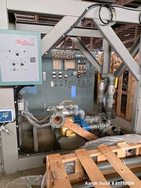 Used Clayton Industries Feedwater Treatment System. (1) Tank. Frame with control panel & (2) pumps. (2) Water softners.
