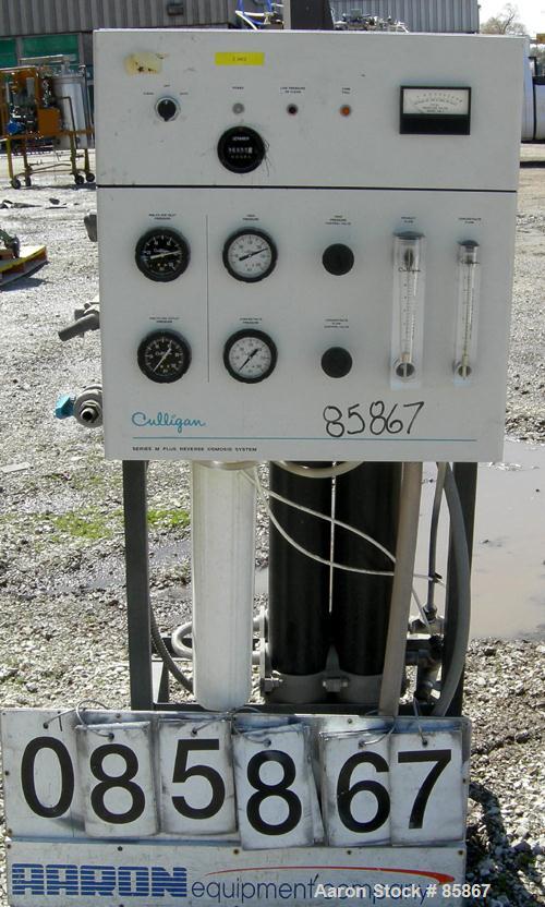 USED: Culligan Aqua-Cleer Series M water treatment reverse osmosis system. Approximately 1 gallon per minute flow rate. Max operating pressure 200 psi. (2) Cartridges, 39,315 hours on meter.