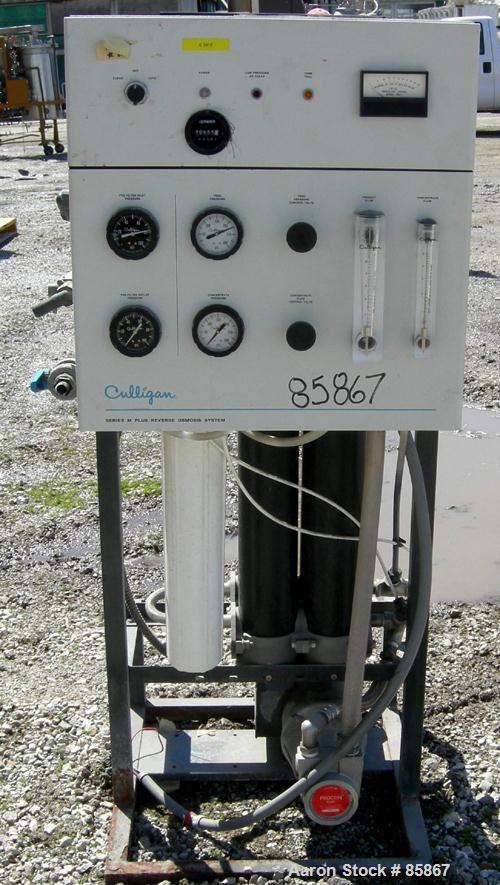 USED: Culligan Aqua-Cleer Series M water treatment reverse osmosis system. Approximately 1 gallon per minute flow rate. Max operating pressure 200 psi. (2) Cartridges, 39,315 hours on meter.