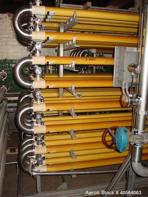 Used Koch Supercor Multi Pass UF Membrane Filter System consisting of: Membrane filter system, membrane filter, control panel, 300 gallon stainless steel sloped bottom permeate CIP tank, pump, typica...
