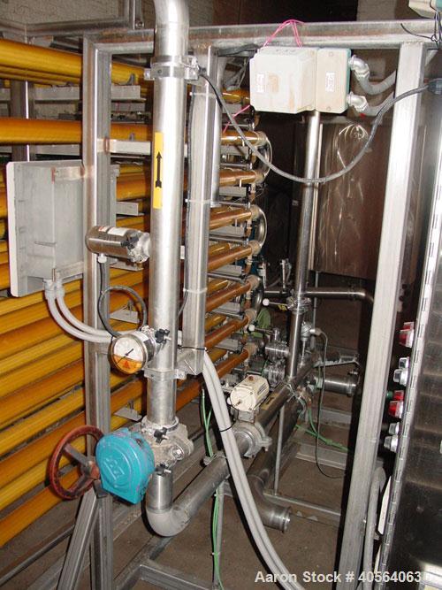 Used Koch Supercor Multi Pass UF Membrane Filter System consisting of: Membrane filter system, membrane filter, control panel, 300 gallon stainless steel sloped bottom permeate CIP tank, pump, typica...