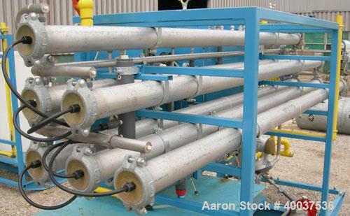 Used: Osmonic Inc reverse osmosis system consisting of: (1) Osmonics reverse osmosis 6 effect system, Model 43B-HR(PA)36KY/DLX. (6) 4" diameter x 126" long tubes. Permeate rate at 77 deg.f.. 13 gallo...