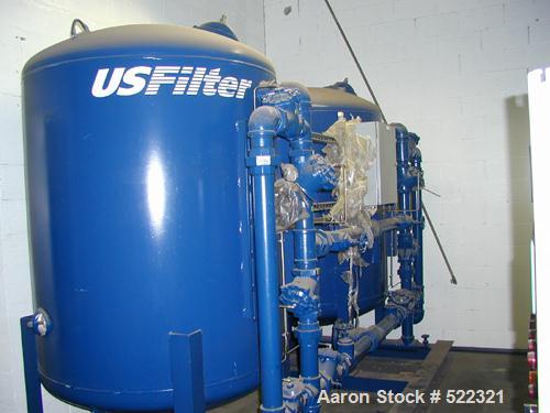 Unused- US Filter Reverse Osmosis System CF-1, Model T942530-00, Type 24FM04A-3F-IP. Two tank carbon filter system, two tank multimedia unit, two tank water softener, five tube RO unit with control p...