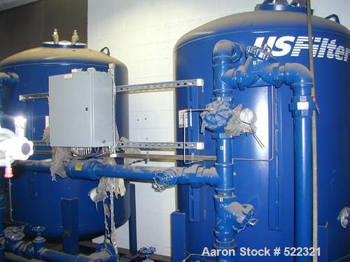 Unused- US Filter Reverse Osmosis System CF-1, Model T942530-00, Type 24FM04A-3F-IP. Two tank carbon filter system, two tank multimedia unit, two tank water softener, five tube RO unit with control p...