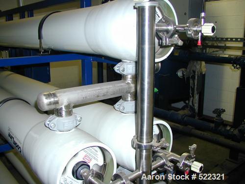 Unused- US Filter Reverse Osmosis System CF-1, Model T942530-00, Type 24FM04A-3F-IP. Two tank carbon filter system, two tank multimedia unit, two tank water softener, five tube RO unit with control p...