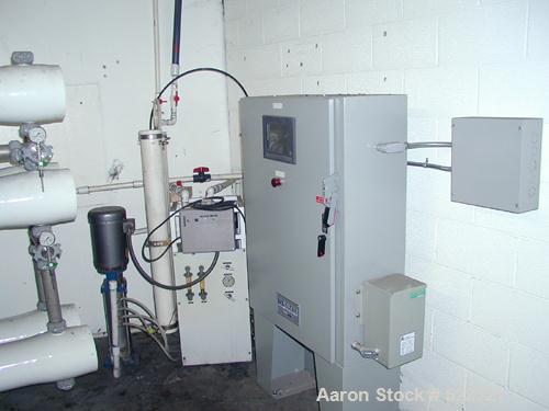 Unused- US Filter Reverse Osmosis System CF-1, Model T942530-00, Type 24FM04A-3F-IP. Two tank carbon filter system, two tank multimedia unit, two tank water softener, five tube RO unit with control p...