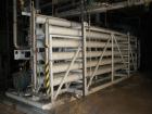 Used Zenon Environmental Inc Reverse Osmosis System. 250 psi operating pressure at 35 deg C, perm rate 240 USGPM, 11 tubes are 9