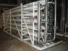 Used Zenon Environmental Inc Reverse Osmosis System. 250 psi operating pressure at 35 deg C, perm rate 240 USGPM, 11 tubes are 9