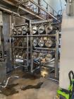 Unused- Reverse Osmosis Filtration System. 9500 liter/hour capacity. 2205 square meters total membrane area. System consisting of: (18) filters; 316 SS CIP tank; (2) 3500 RPM CIP pumps; Goulds booste...