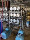 Unused- Reverse Osmosis Filtration System. 9500 liter/hour capacity. 2205 square meters total membrane area. System consisting of: (18) filters; 316 SS CIP tank; (2) 3500 RPM CIP pumps; Goulds booste...
