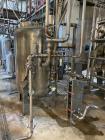 Unused- Reverse Osmosis Filtration System. 9500 liter/hour capacity. 2205 square meters total membrane area. System consisting of: (18) filters; 316 SS CIP tank; (2) 3500 RPM CIP pumps; Goulds booste...
