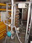 Used Koch Supercor Multi Pass UF Membrane Filter System consisting of: Membrane filter system, membrane filter, control panel, 300 gallon stainless steel sloped bottom permeate CIP tank, pump, typica...