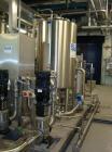 Used Vivendi Purified Water Softener Skids consisting of: (1) Forbes approximately 10,000 litre HDPE tank, (2) Grunfoss type CRNE45-2, 45cumt/hr pumps, (1) Elga model 611530AA40C1EE filter, (1) Bibby...