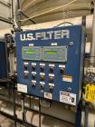 Used U.S. Filter Reverse Osmosis Open Skid Unit, Model 67/FM3-18,  75 GPM capacity.   Includes T&T Pump Co Pump Model 612, Driven by a 30hp 3/60/230/460v 3560rpm motor. Mounted control panel with (2)...
