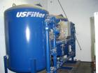 Unused- US Filter Reverse Osmosis System CF-1, Model T942530-00, Type 24FM04A-3F-IP. Two tank carbon filter system, two tank multimedia unit, two tank water softener, five tube RO unit with control p...