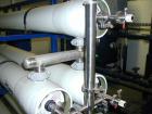 Unused- US Filter Reverse Osmosis System CF-1, Model T942530-00, Type 24FM04A-3F-IP. Two tank carbon filter system, two tank multimedia unit, two tank water softener, five tube RO unit with control p...